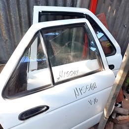 Chapa de puerta Nissan v-16 twimcan año:2000