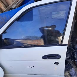 Chapa de puerta Nissan v-16 twimcan año:2002