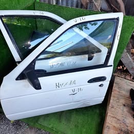 Chapa de puerta Nissan v-16 twimcan año:2004