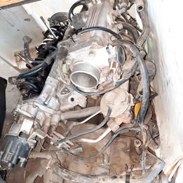 Cuerpo de aceleración Nissan v-16 tapa Roja año:1994