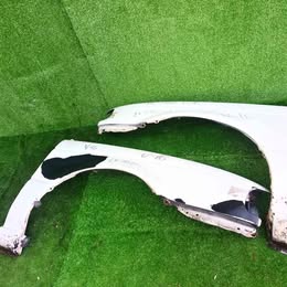 Dos tapa barros Nissan v-16 ex-salon año:2000