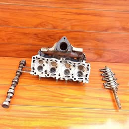 Múltiple de escape Nissan v-16 tapa Roja año:1994