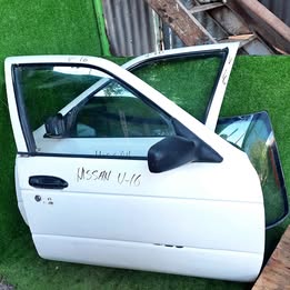 Vidrio de puerta Nissan v-16 twimcan año:2005