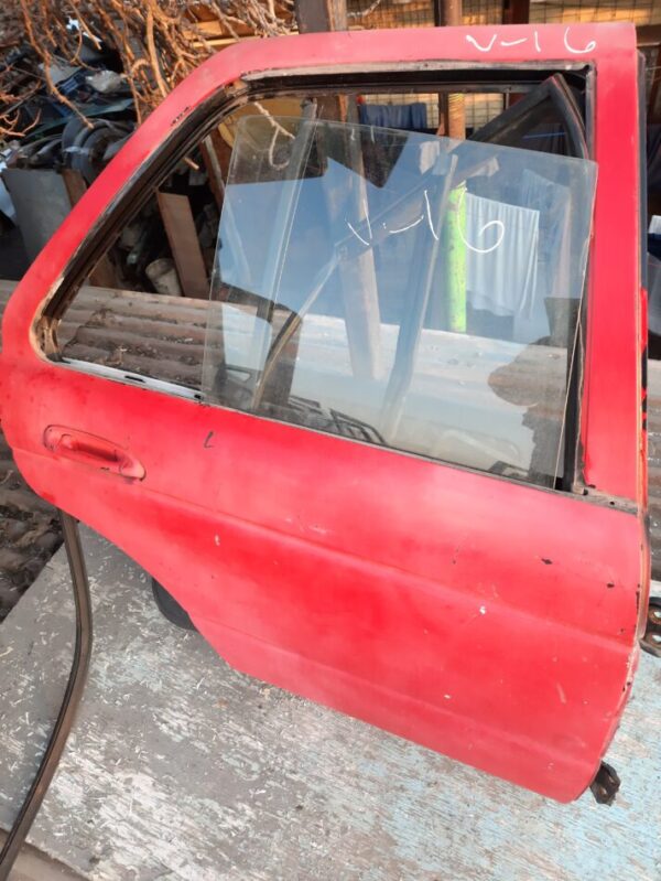 vidrio puerta trasera Nissan v-16 twimcan año:2005